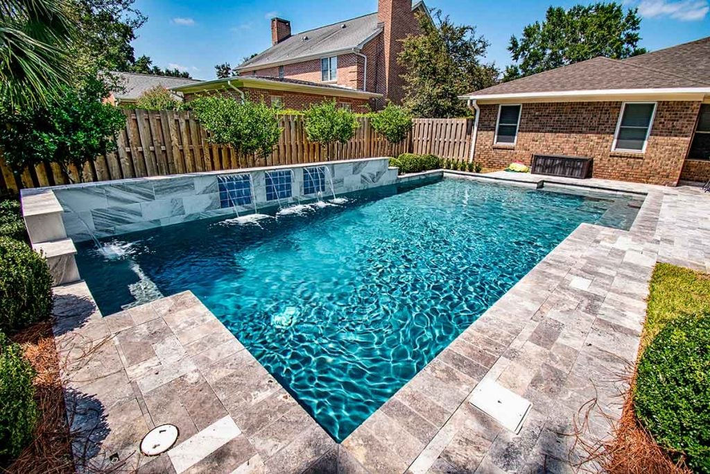 Luxury inground pool with sheer descents - retaining wall