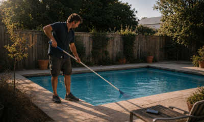pool technician cleaning a swimming pool